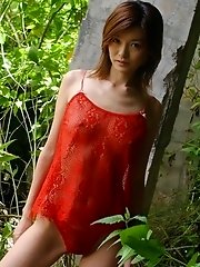 Asian slut in red lingerie shows her tits